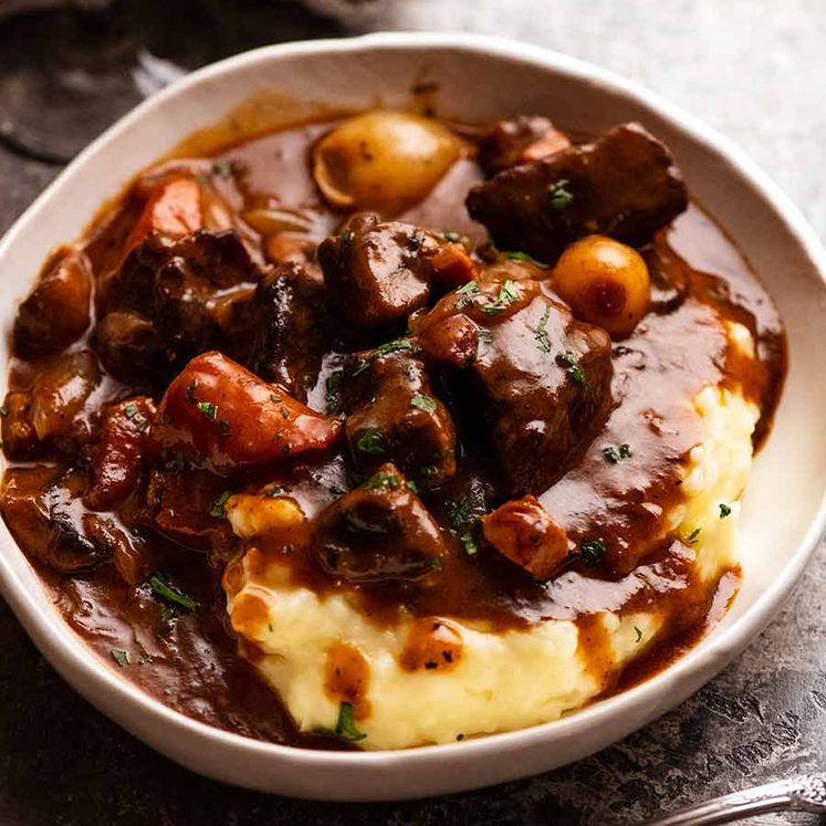 Beef Bourguignon served over creamy mashed potato