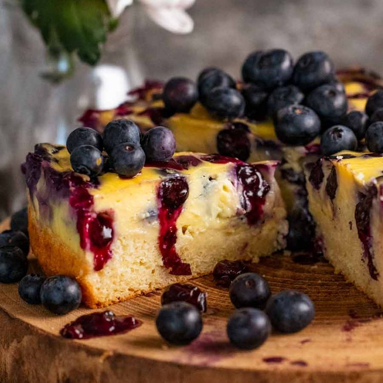 Close up of a slice of Blueberry Custard Cake