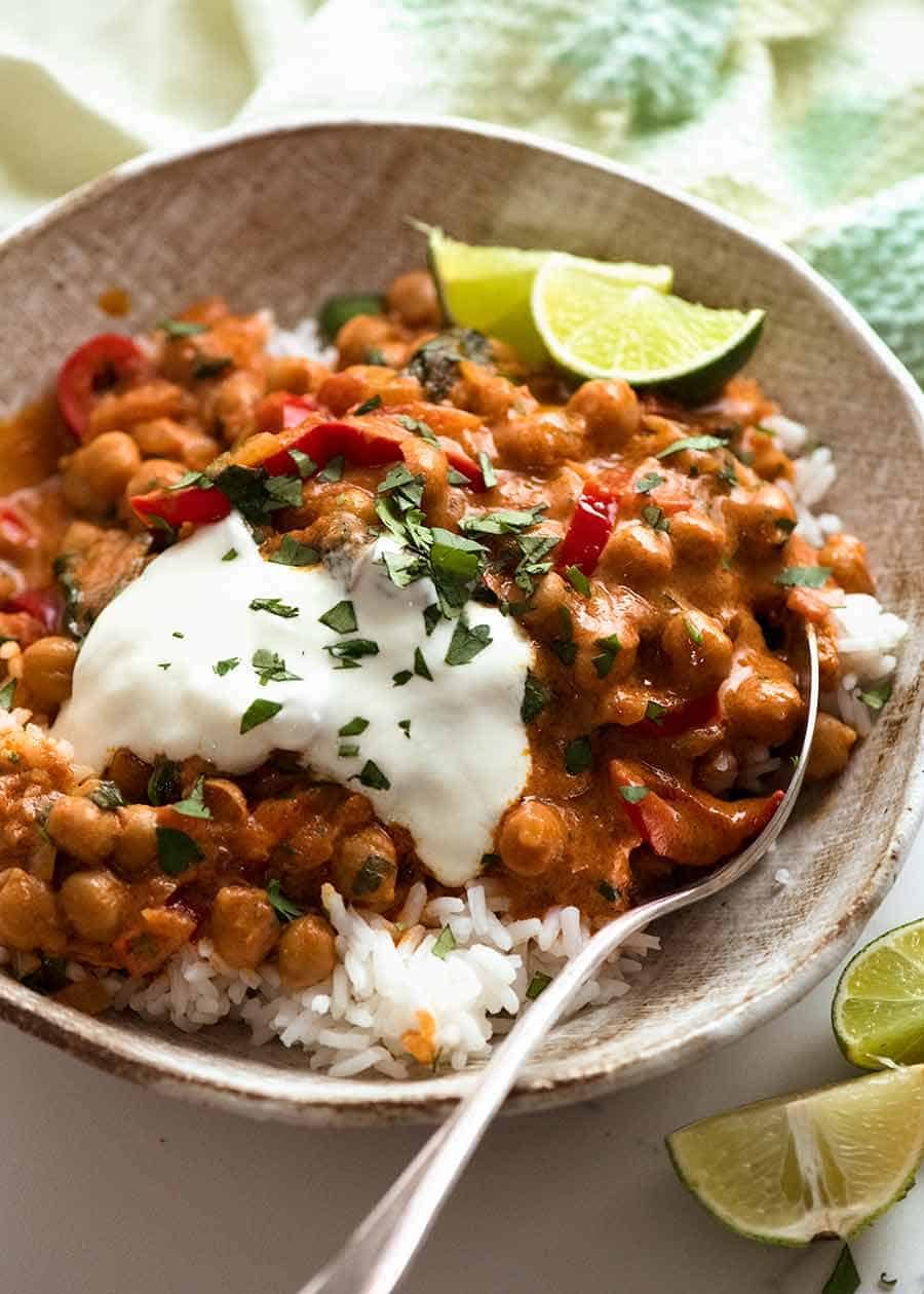 Brazilian Chickpea Curry in a bowl served over rice, ready to be eaten