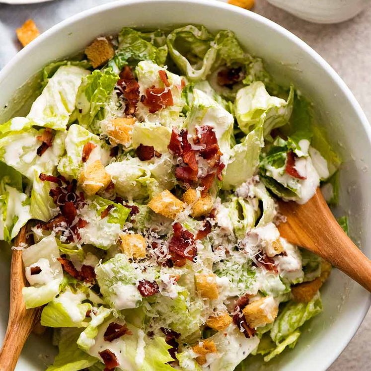 Caesar Salad in a white bowl, ready to be served