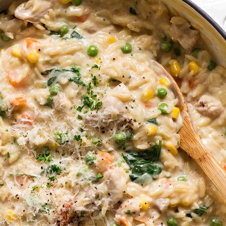 Creamy Chicken Vegetable Orzo in a skillet, fresh off the stove. Quick one pot chicken dinner - 15 minutes!