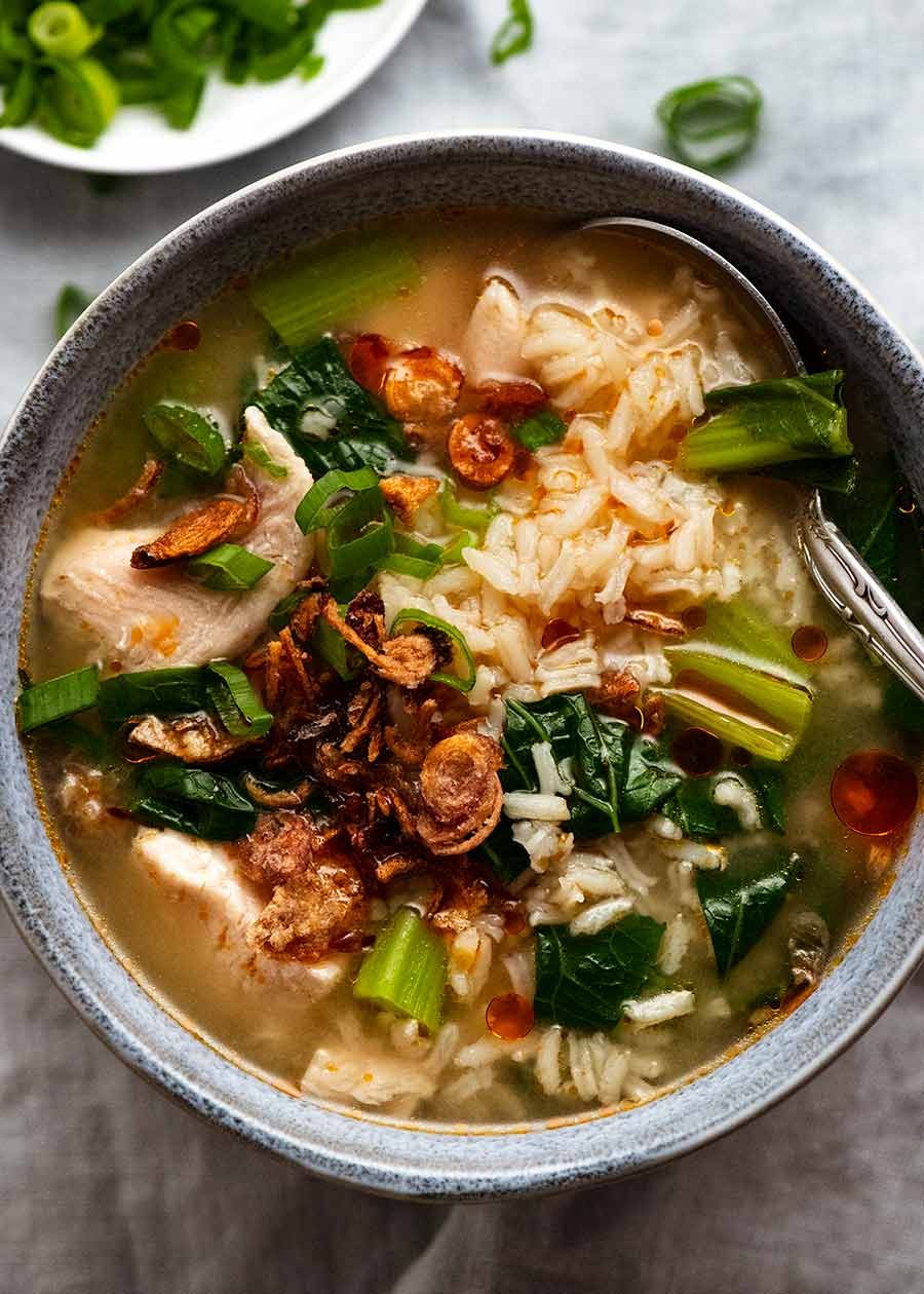 Overhead photo of Chinese Rice Soup in a blue bowl, ready to be eaten