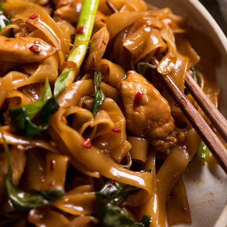 Close up of Thai Drunken Noodles with chopsticks