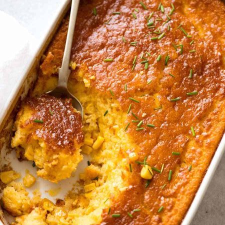 Overhead photo of Corn Casserole in a white dish, fresh out of the oven