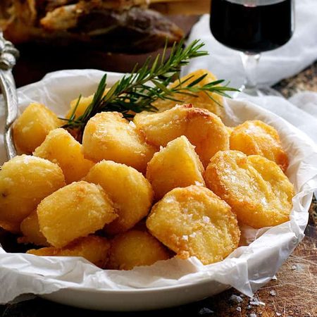 Truly Crunchy Roast Potatoes - par boil, rough up the surface, dust with semolina then bake in a very hot oven in preheated oil. Based on a Nigella recipe.