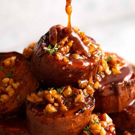 Pouring Maple Butter Sauce over Slow Roasted Fondant Sweet Potatoes