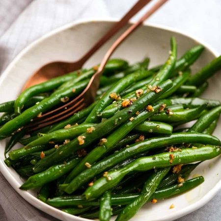 Garlic Sautéed Green Beans on a plate ready to be served