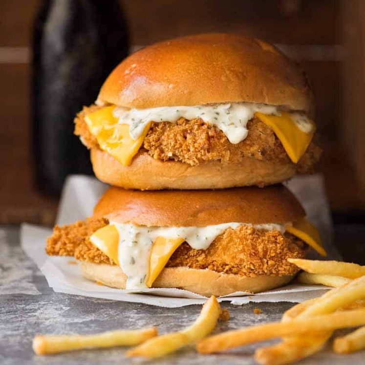 Two Homemade Filet-O-Fish (BAKED!) stacked on top of each other with a side of fries