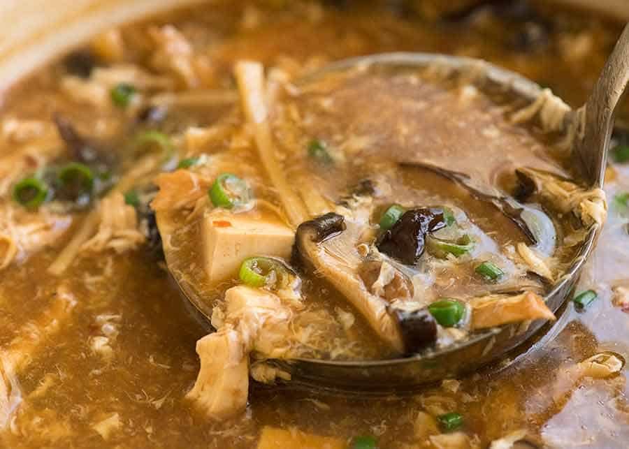 Image of Hot and Soup Soup being ladled out of a pot, fresh off the stove