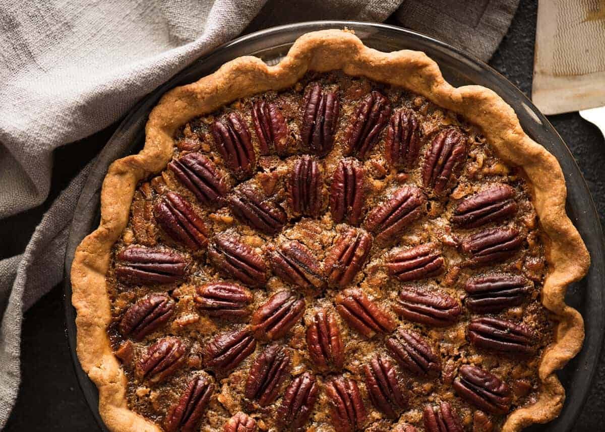 Learn how to make Pecan Pie, the great American classic! Flaky all-butter pie crust with a soft set filling, the quick video tutorial will be very helpful will guide you to nail this every time! recipetineats.com