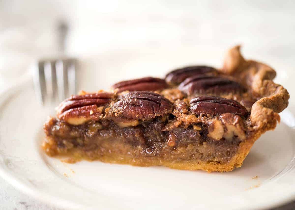 Learn how to make Pecan Pie, the great American classic! Flaky all-butter pie crust with a soft set filling, the quick video tutorial will be very helpful will guide you to nail this every time! recipetineats.com