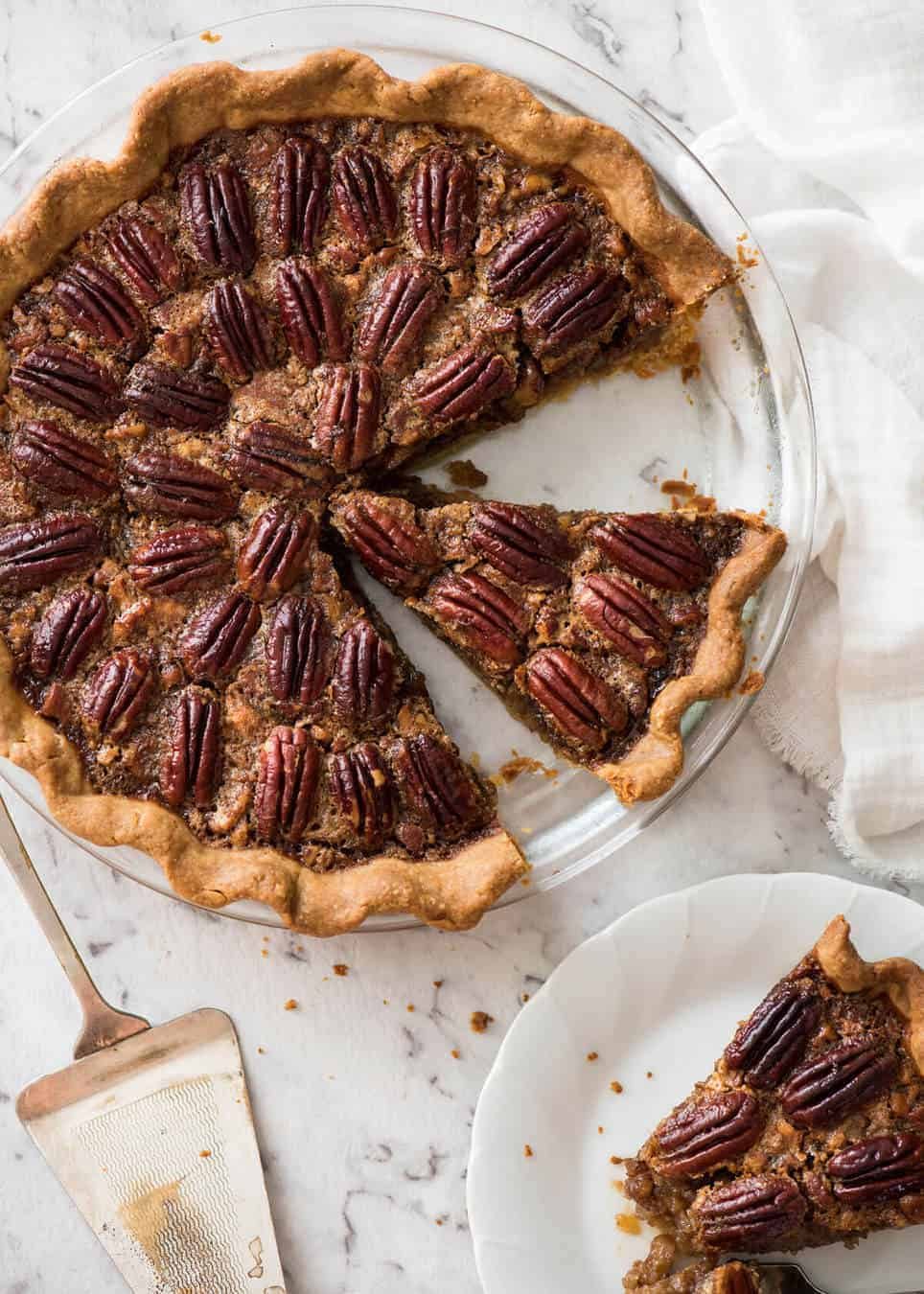 Learn how to make Pecan Pie, the great American classic! Flaky all-butter pie crust with a soft set filling, the quick video tutorial will be very helpful will guide you to nail this every time! recipetineats.com