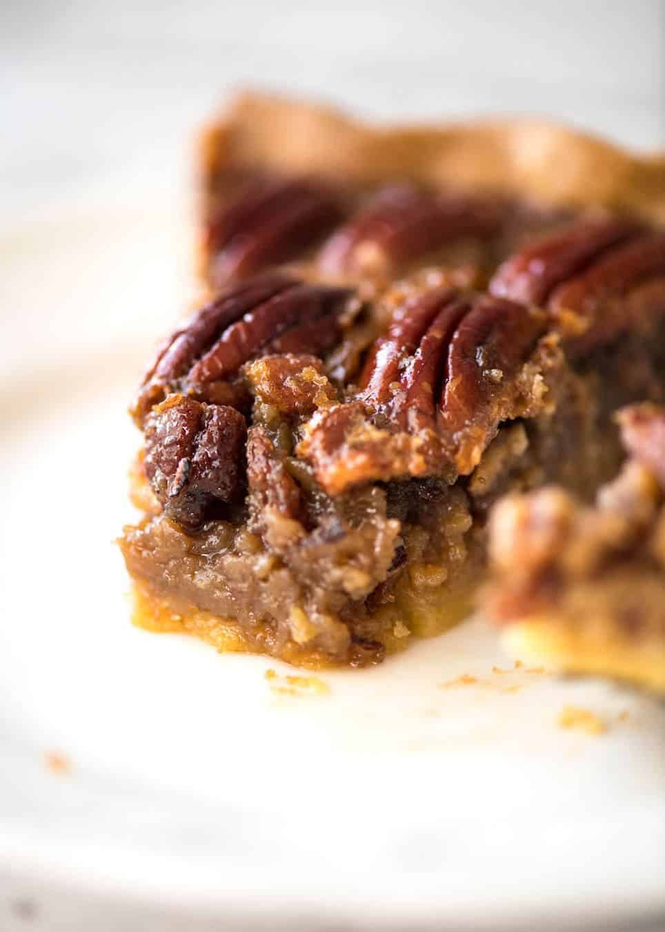 Learn how to make Pecan Pie, the great American classic! Flaky all-butter pie crust with a soft set filling, the quick video tutorial will be very helpful will guide you to nail this every time! recipetineats.com