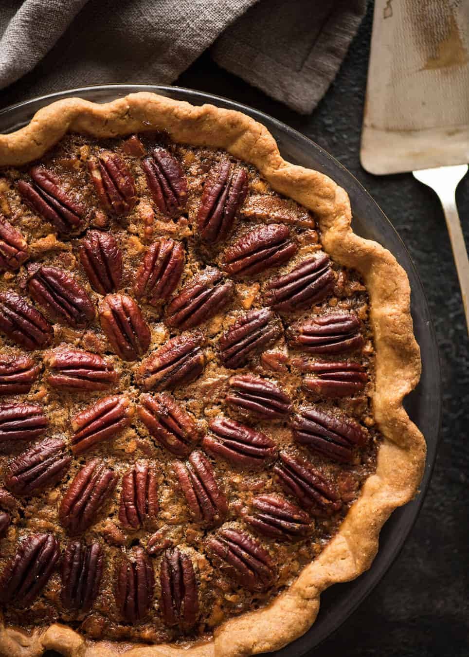 Learn how to make Pecan Pie, the great American classic! Flaky all-butter pie crust with a soft set filling, the quick video tutorial will be very helpful will guide you to nail this every time! recipetineats.com