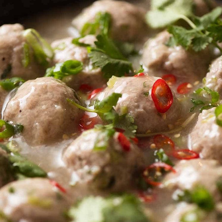 Vietnamese Pork Meatballs for Banh Mi in a black skillet, ready to be served