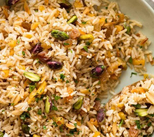 Close up of Rice Pilaf in a green bowl, ready to be served