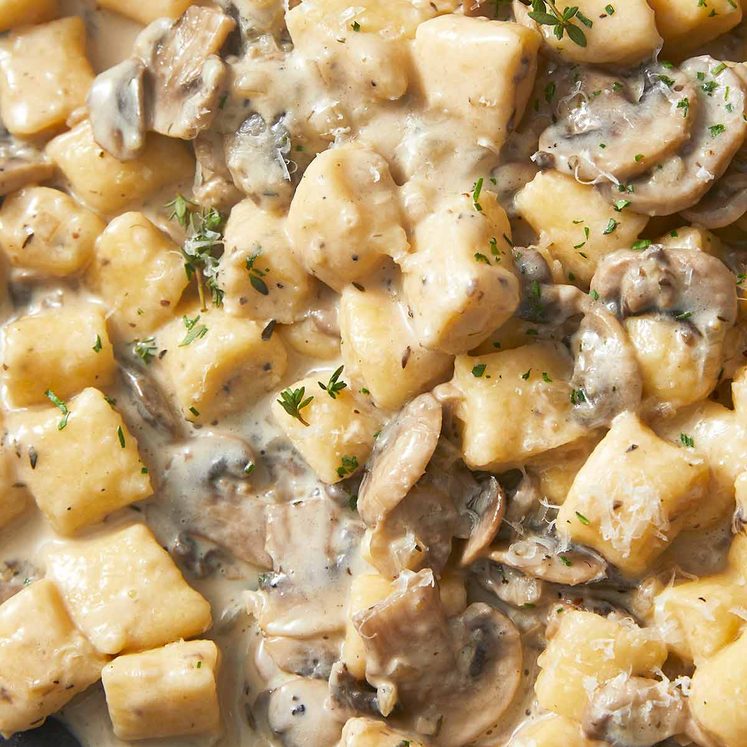 Close up of Ricotta gnocchi with creamy mushroom sauce