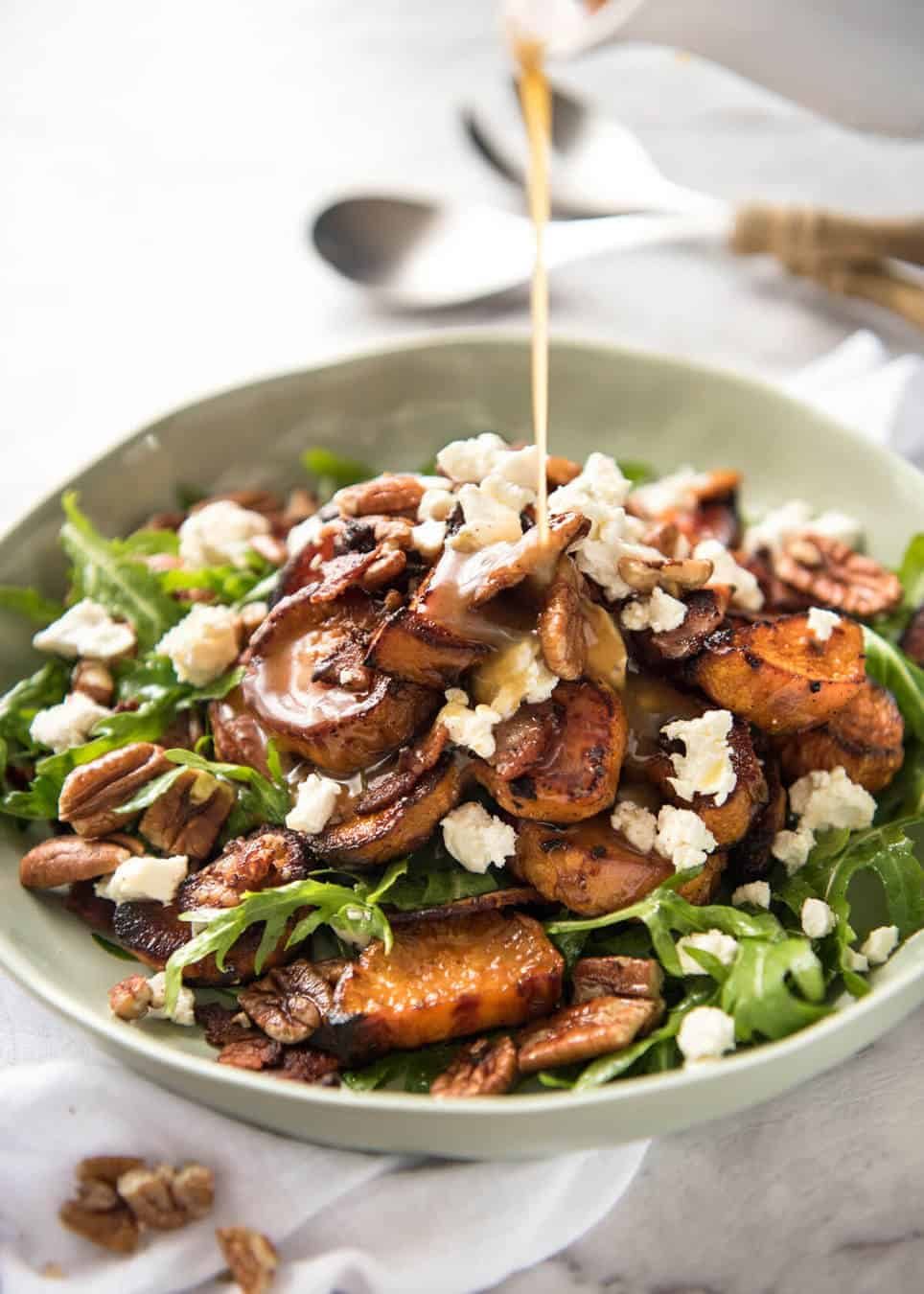 Roasted Sweet Potato Salad - with arugula/rocket, pecans, goats cheese or feta, a sprinkle of bacon and a beautiful Honey Lemon dressing. www.recipetineats.com