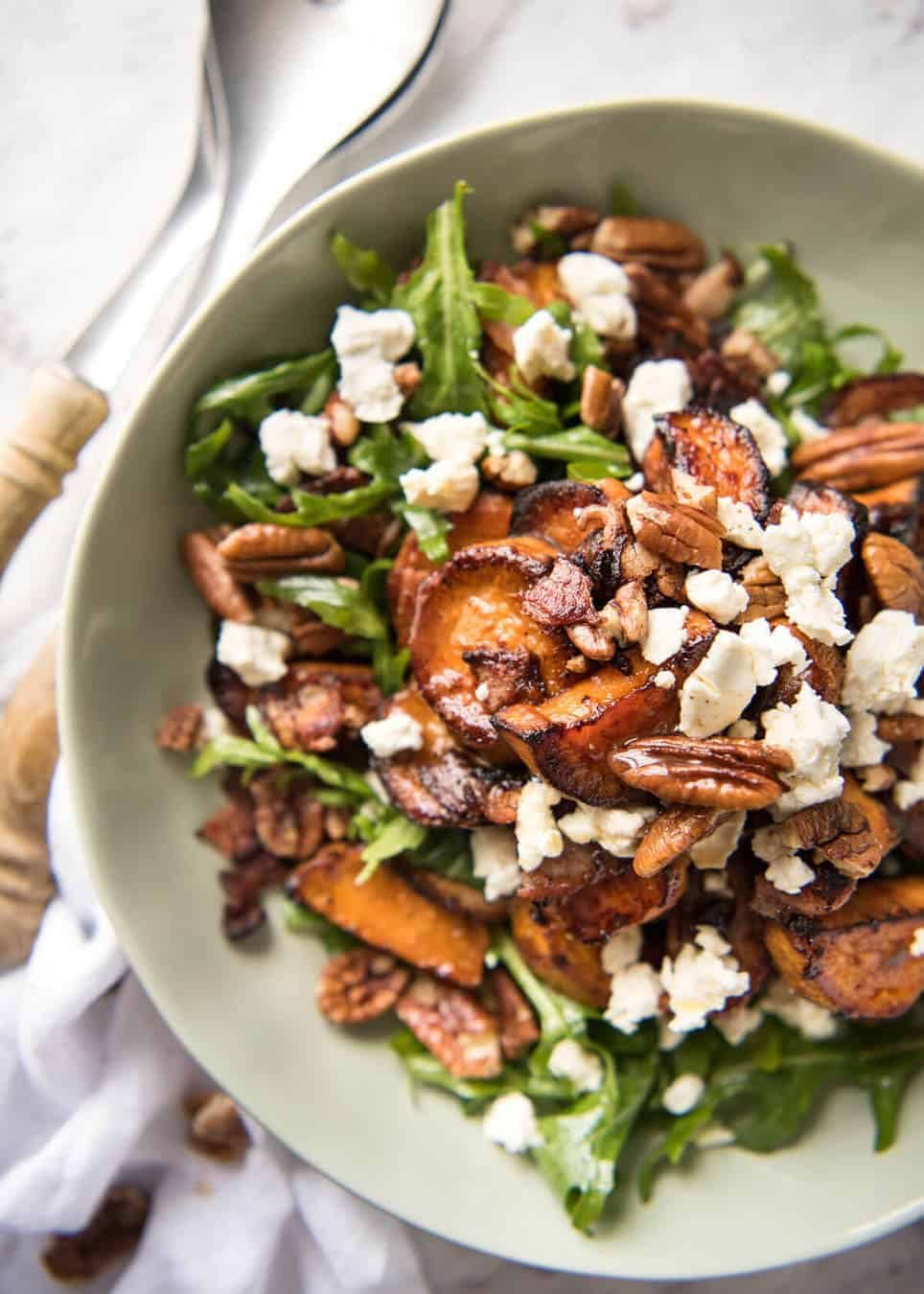 Roasted Sweet Potato Salad - with arugula/rocket, pecans, goats cheese or feta, a sprinkle of bacon and a beautiful Honey Lemon dressing. www.recipetineats.com