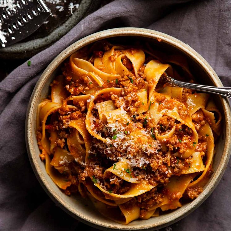 Sausage ragu pasta sauce with pappardelle in a bowl ready to be eaten