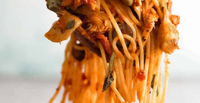 Sicilian Chicken Spaghetti being tossed in sauce