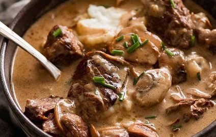 Slow Cooked Beef with Stroganoff Sauce served over mashed potato