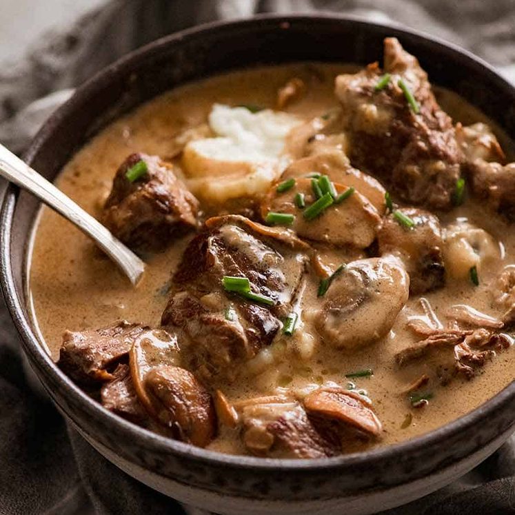 Slow Cooked Beef with Stroganoff Sauce served over mashed potato