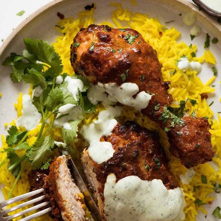 Tandoori Chicken served with saffron rice and minted yogurt sauce