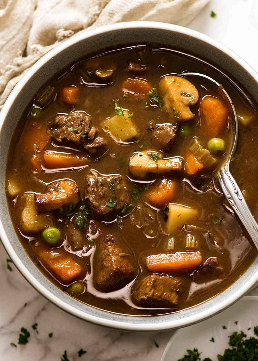 Overhead photo of Vegetable Beef Soup with tender, slow cooked beef in a bowl, ready to be eaten