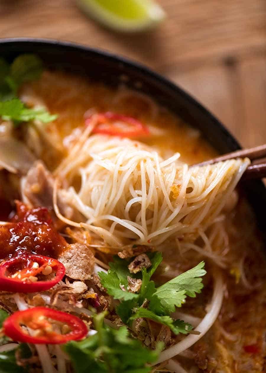 Vermicelli Noodles in Laksa Soup broth in a pot, fresh off the stove