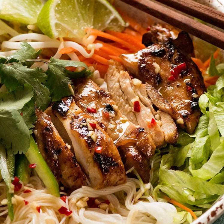 Close up of Vietnamese Noodles with Lemongrass marinated chicken in a bowl, ready to be eaten