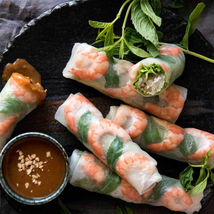 Jam packed with fresh, bright flavours, learn how to make Vietnamese Rice Paper Rolls with an easy to follow video tutorial and step by step photos. Served with an addictive Vietnamese Peanut Dipping Sauce! www.recipetineats.com